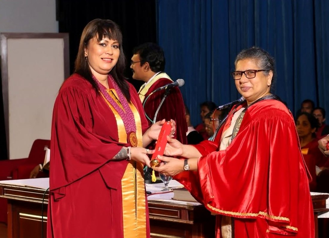 Dr. Anna W Karunatilleke receiving her doctoral regalia at her University of Kelaniya convocation